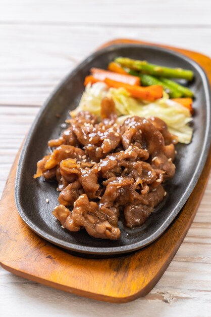 sliced pork steak on hot plate 