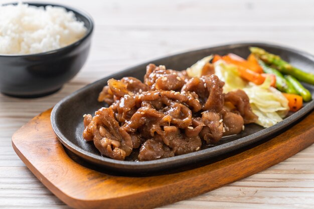 sliced pork steak on hot plate 