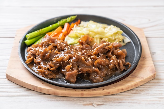 sliced pork steak on hot plate 