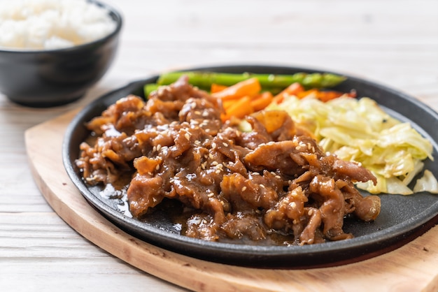 sliced pork steak on hot plate 