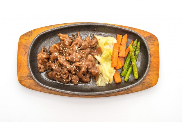 sliced pork steak on hot plate 