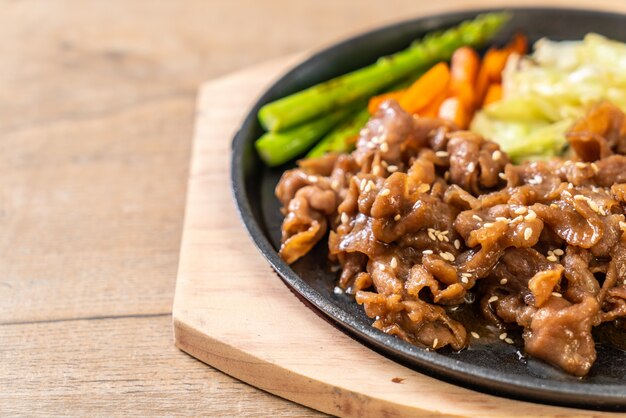 sliced pork steak on hot plate