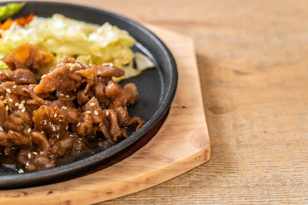 sliced pork steak on hot plate