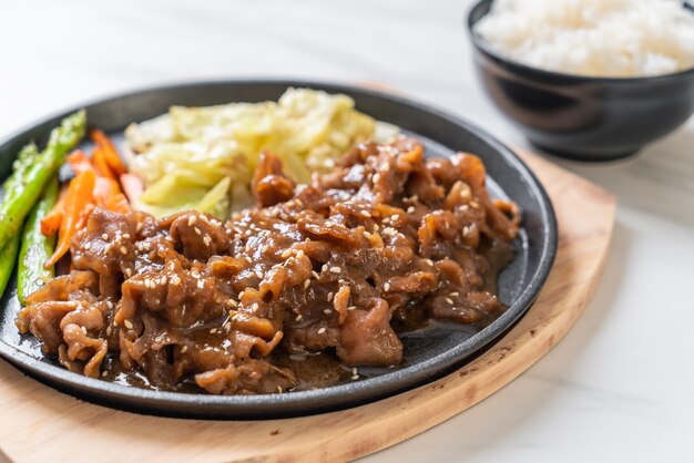 sliced pork steak on hot plate