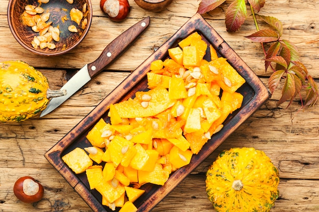 Sliced pumpkin on kitchen board