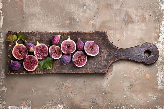 Sliced purple figs arranged on a wooden cutting board