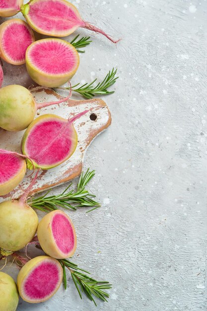 Sliced radish watermelon on the kitchen stone table diet food Free space for text on stone background