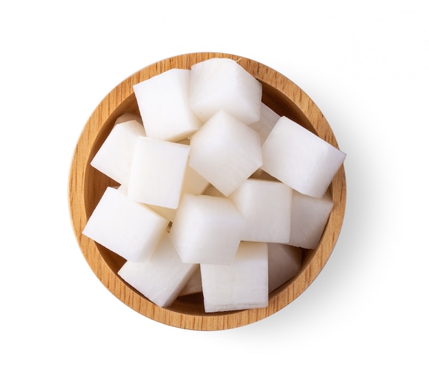 Sliced radishes in wood bowl