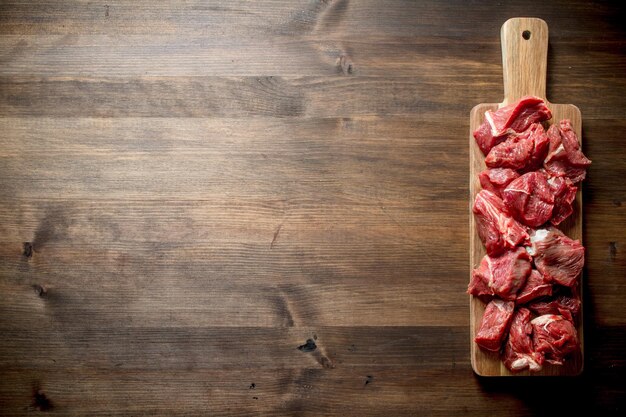 Sliced raw beef on a cutting board