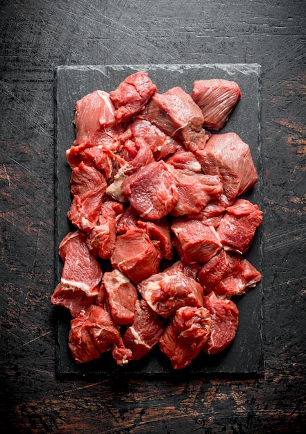 Sliced raw beef on a stone Board