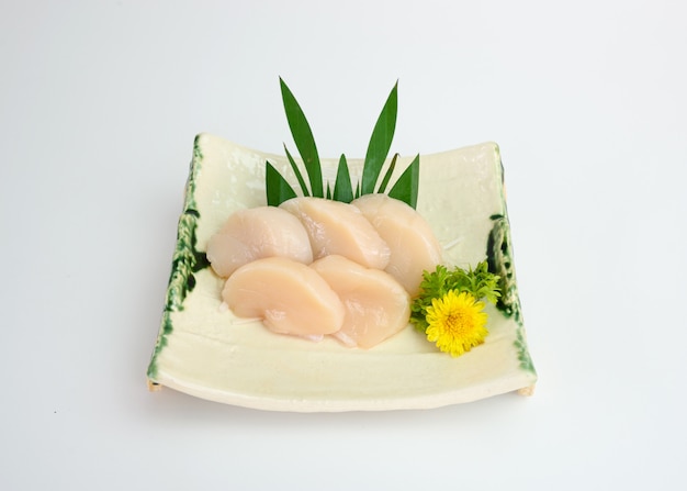Sliced raw Hotate shell sashimi on plate