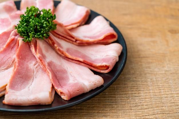 sliced raw pork bacon