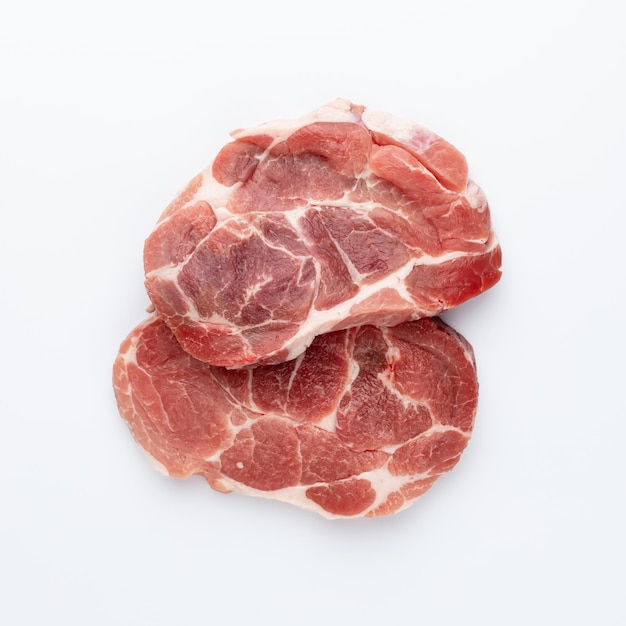 Sliced raw pork meat isolated on white background.