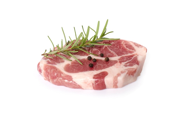 Sliced raw pork meat with rosemary isolated