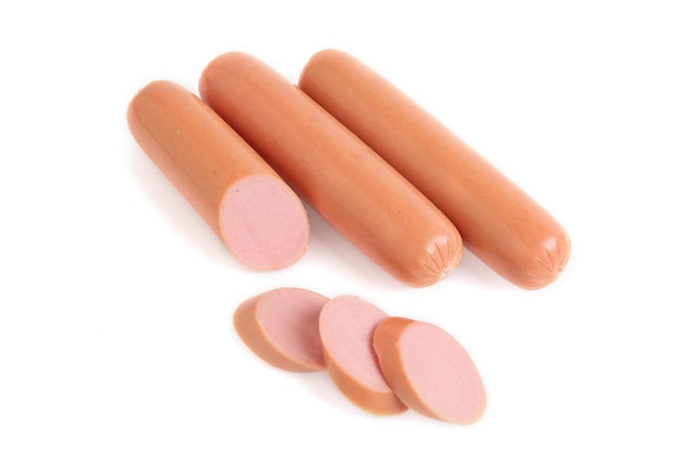 Sliced raw sausages isolated a white surface