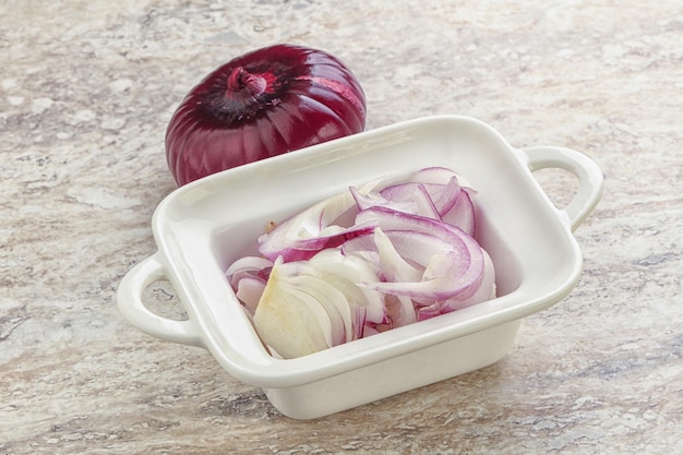 Sliced red onion in the bowl for cooking or snack