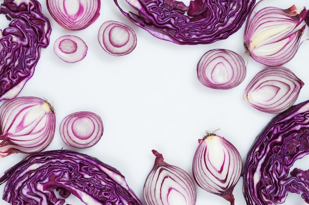 Sliced red onion and cabbage on a white background