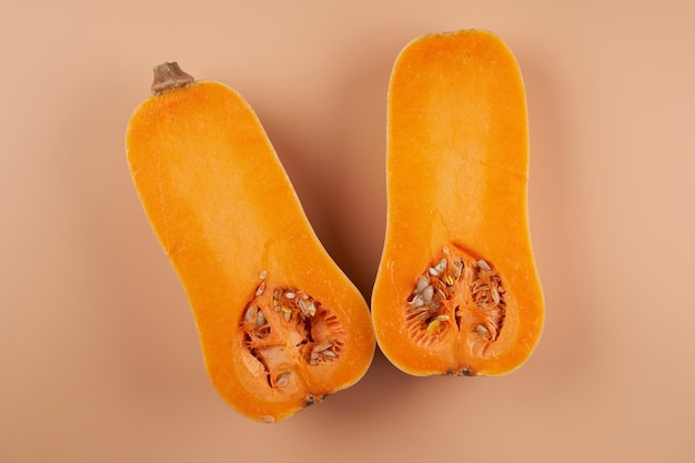 Sliced ripe pumpkin close up orange background