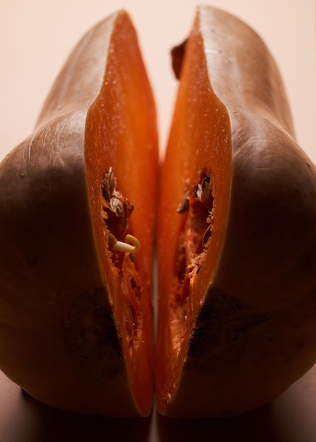 Sliced ripe pumpkin close up orange background