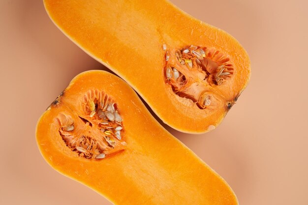 Sliced ripe pumpkin close up orange background