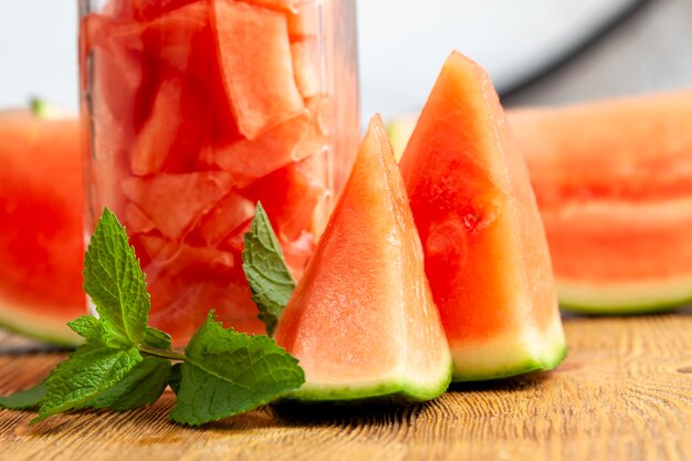 Sliced ripe red watermelon with green fragrant mint