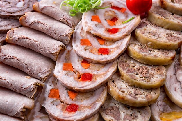 Sliced roast meat and rolls in assortment