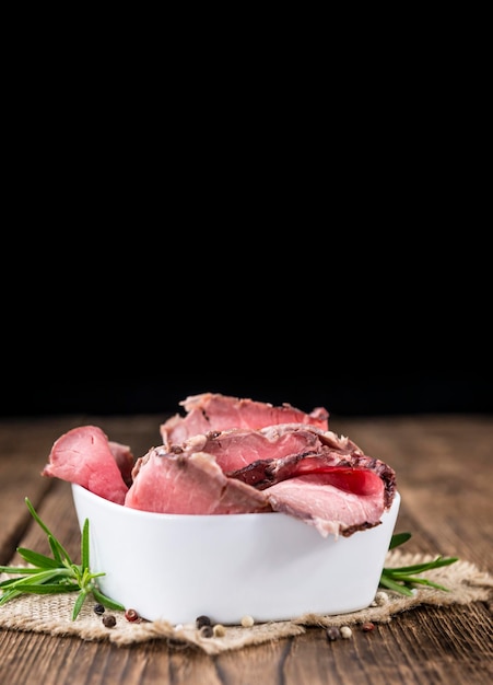 Sliced Roastbeef on wooden background