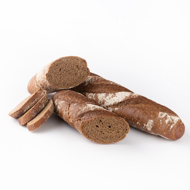 Sliced rye baguette on white