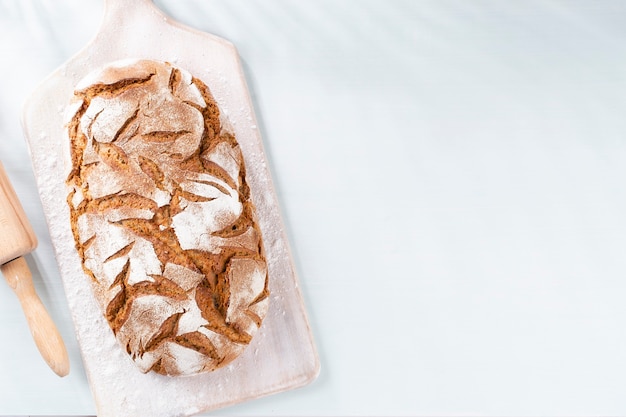 Sliced rye bread on cutting board, closeup..