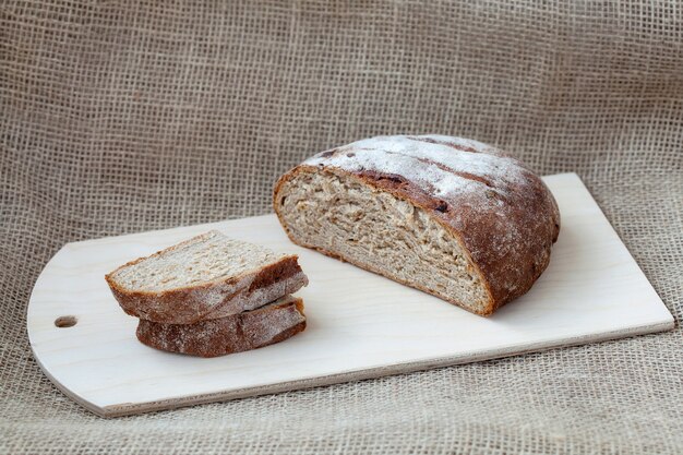 Sliced rye bread on a sacking surface