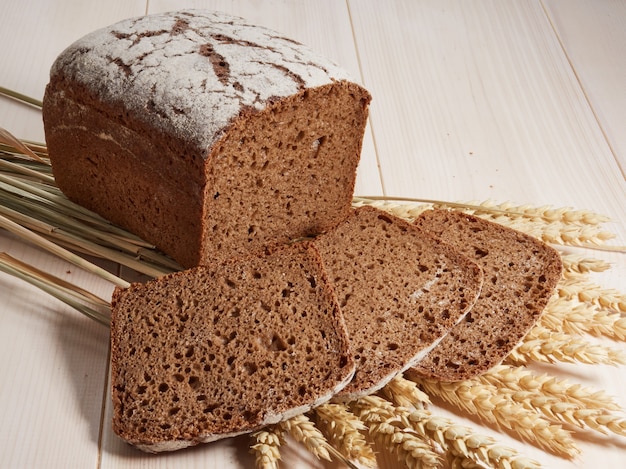 Sliced rye bread on a wooden background