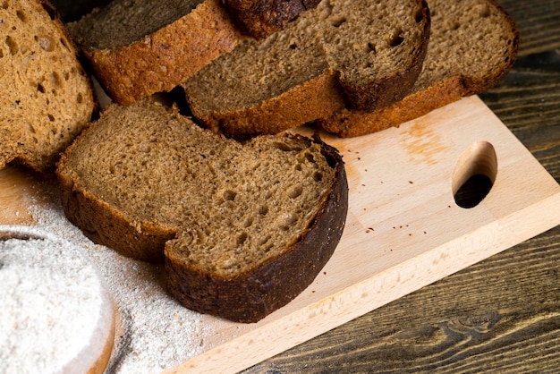 Sliced rye bread on a wooden table close up