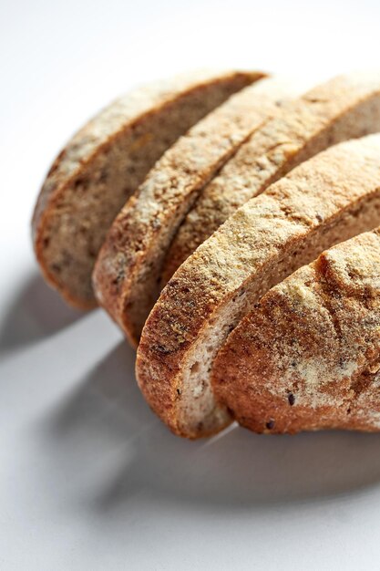 Sliced rye eco bread on a gray background Minimalist composition