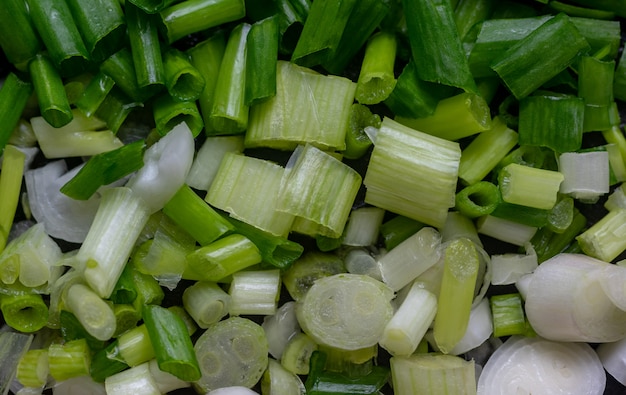 The sliced scallion on wooden board