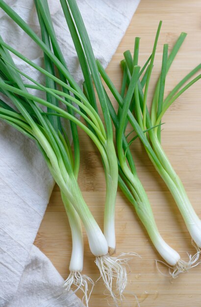 sliced scallion on wooden table