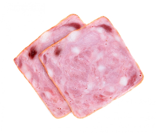 Photo sliced smoked ham isolated on white