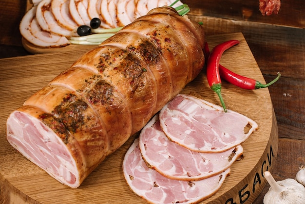 Sliced smoked meat on wooden desk