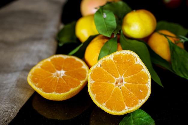 sliced tangerine and oranges on the table