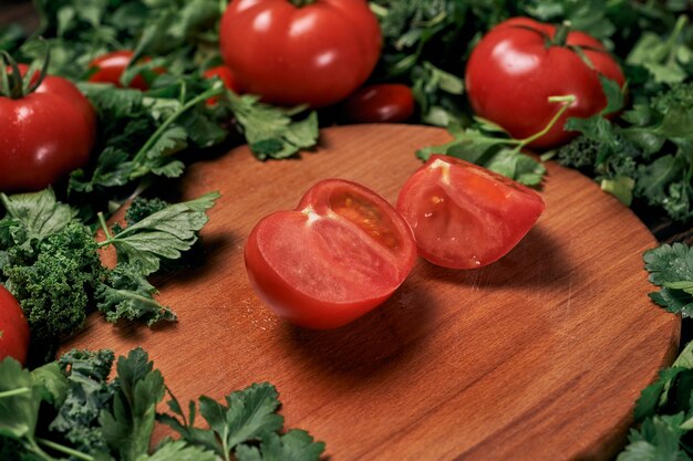 Sliced tomato on a wooden kitchen board