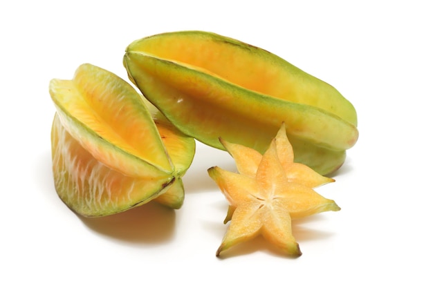 Sliced and two whole fresh organic star fruit delicious isolated on white background clipping path