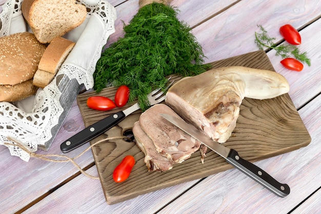 Sliced veal tongue with vegetables