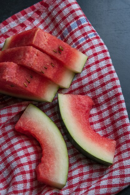 Sliced watermelon on napkin