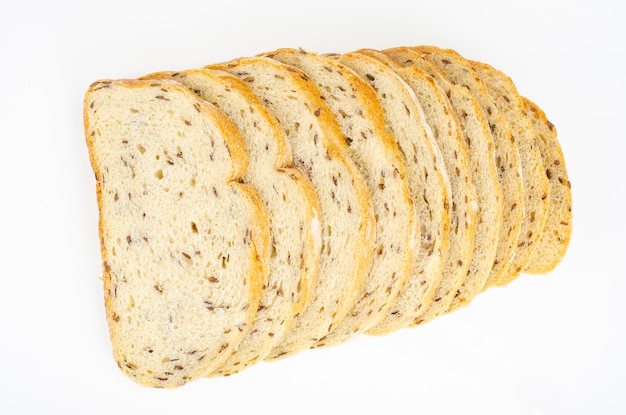 Sliced wheat bread with flax and caraway seeds. Studio Photo.