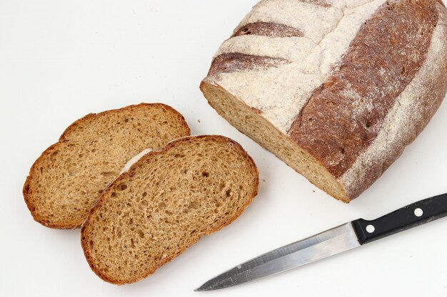 Sliced whole grain flour bread on white