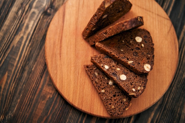 Sliced wholegrain bread on a wooden board