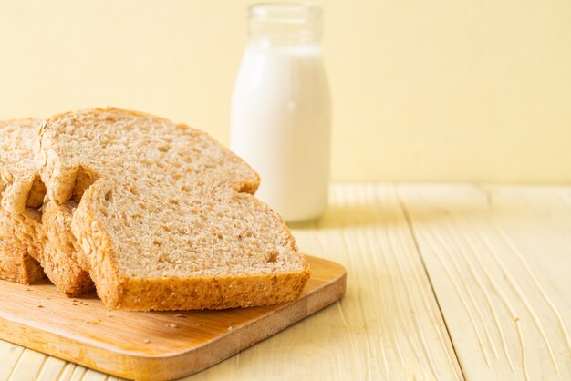 sliced wholegrain bread on wooden table