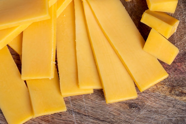 Sliced yellow cheese made from cow's milk