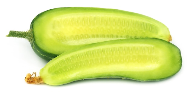 Sliced young cucumber over white background