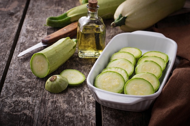 Sliced zucchini in baking dish. Selective focus