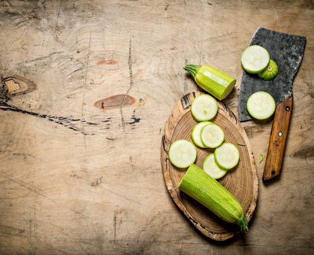 Sliced zucchini and an old hatchet